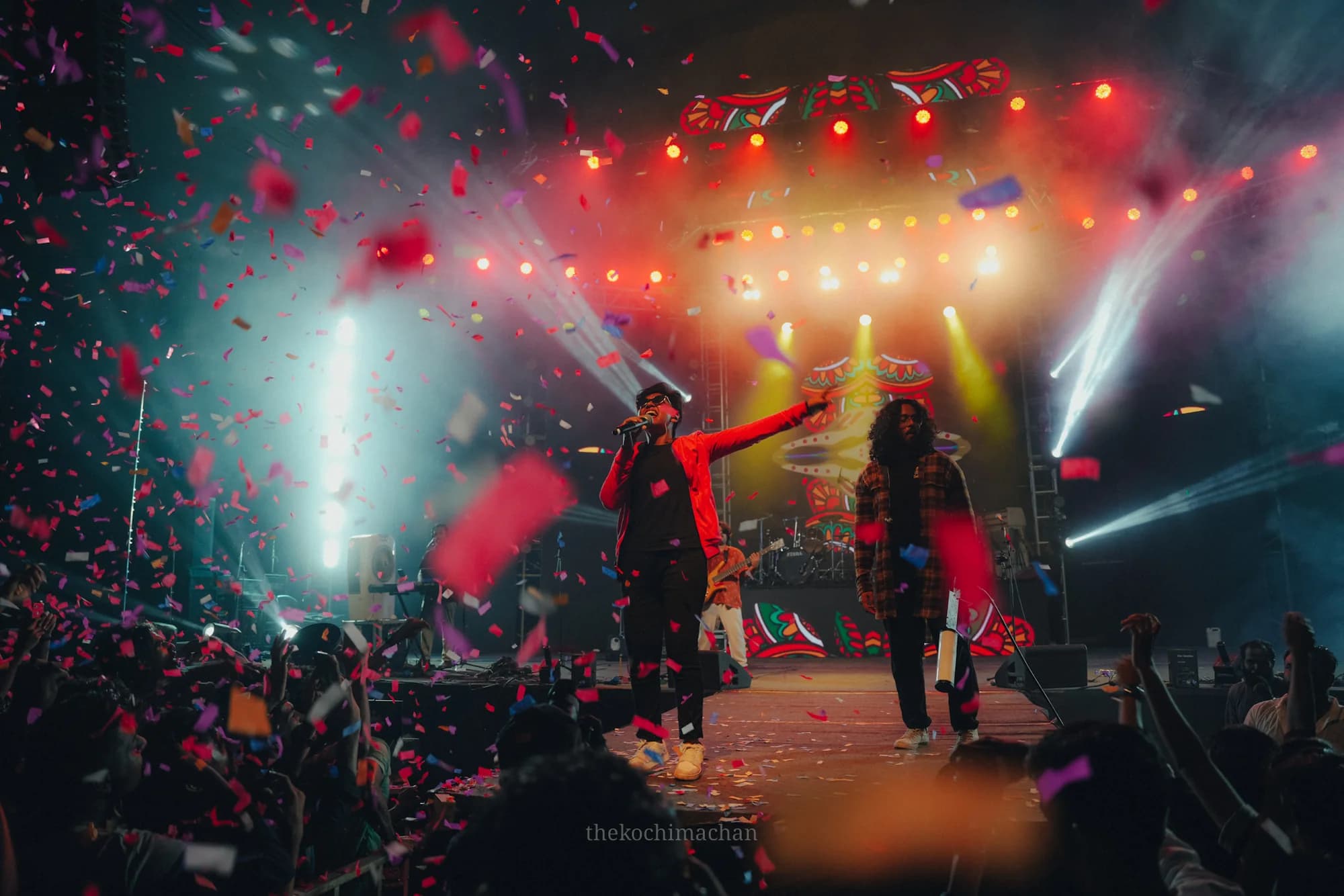 Urumi performing in front of a crowd as confetti falls