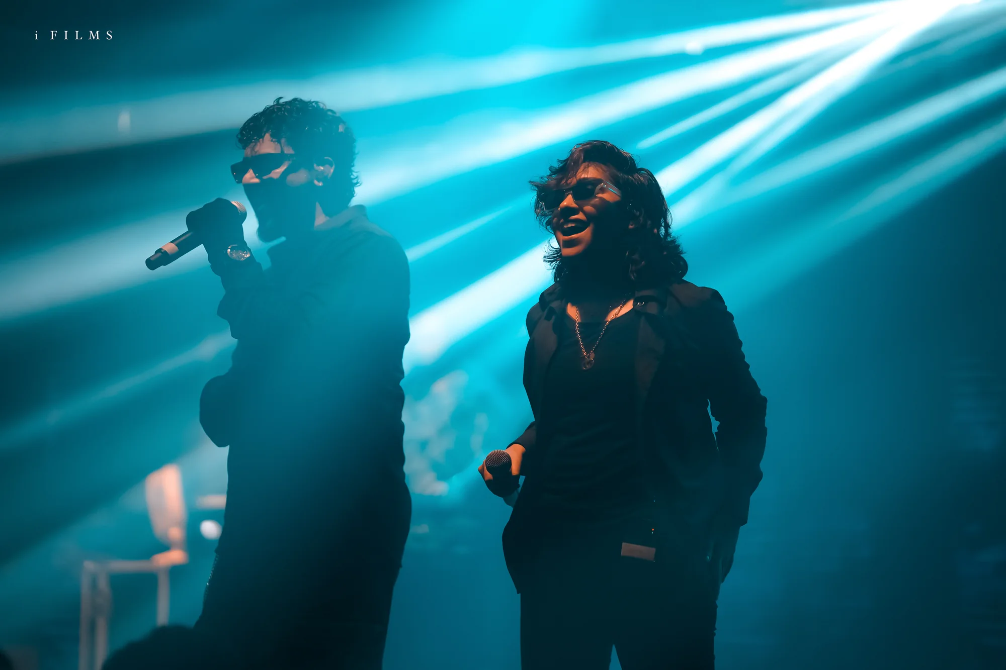 Faisal Razi and Shikha Prabhakaran sharing the Urumi stage beneath blue lights